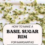 Text: How to make a basil sugar rim for margaritas, get the recipe at allaboutmargaritas.com, with dried candied basil spread out on a baking sheet.