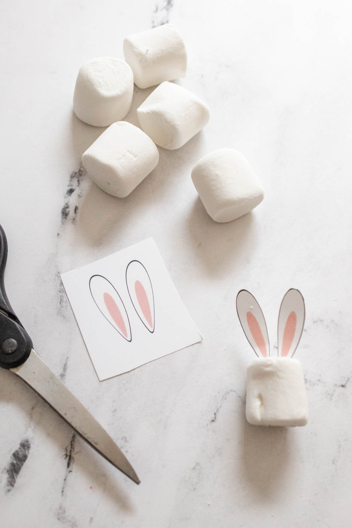 Marshmallows and printable bunny ears for a drink garnish for Easter drinks.