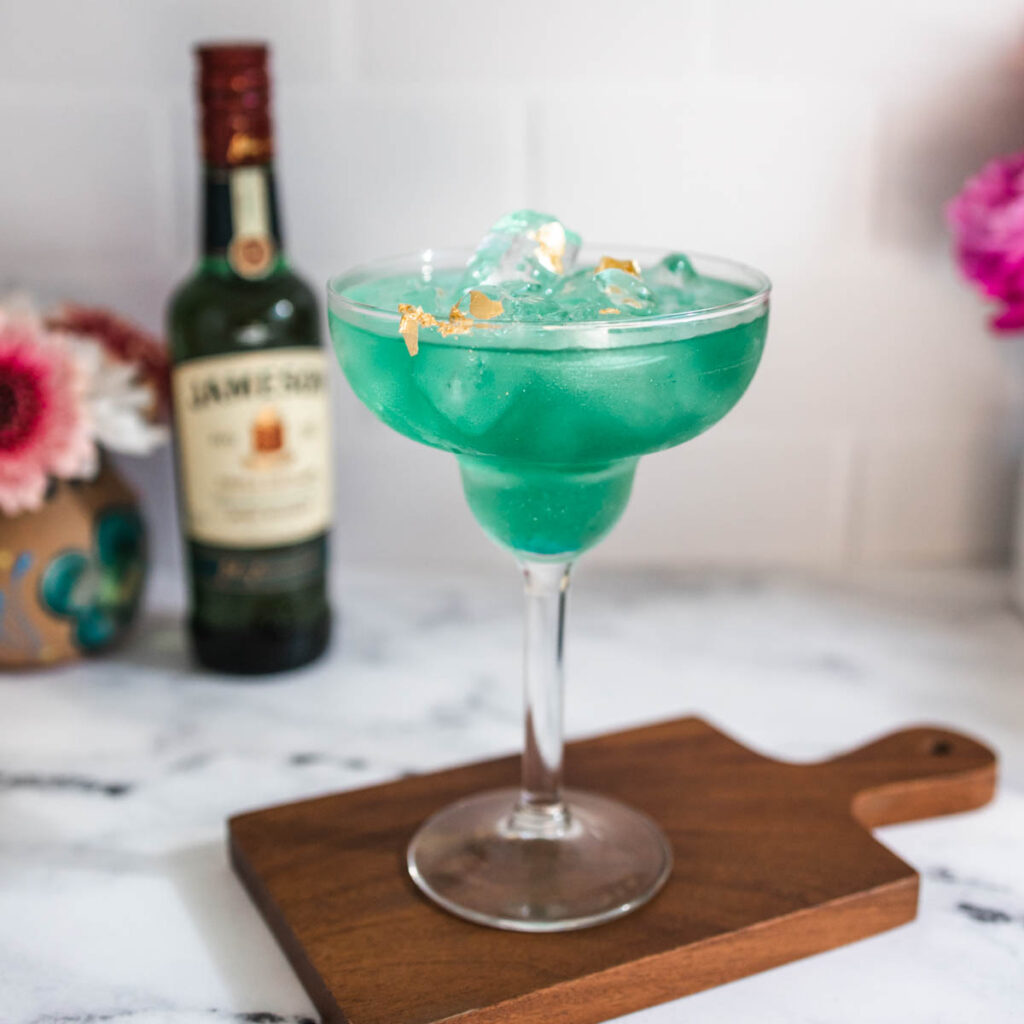 An Irish Margarita that's green in a margarita glass.