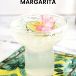 A delicious, extra- special margarita that's made from Clase Azul Tequila and decorated with lime wheel, edible flowers and gold leaves,